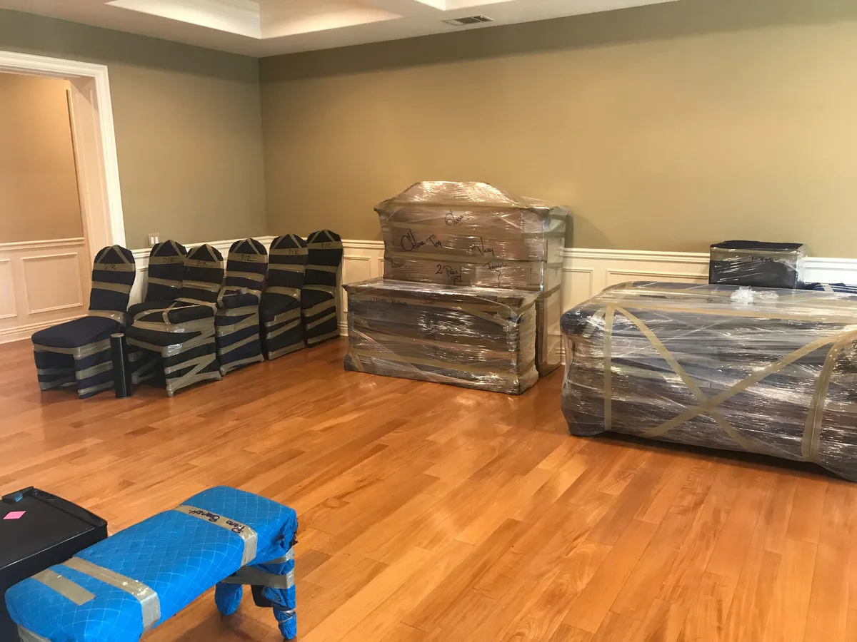 Wrapped furniture pieces labeled fragile, ready to load
