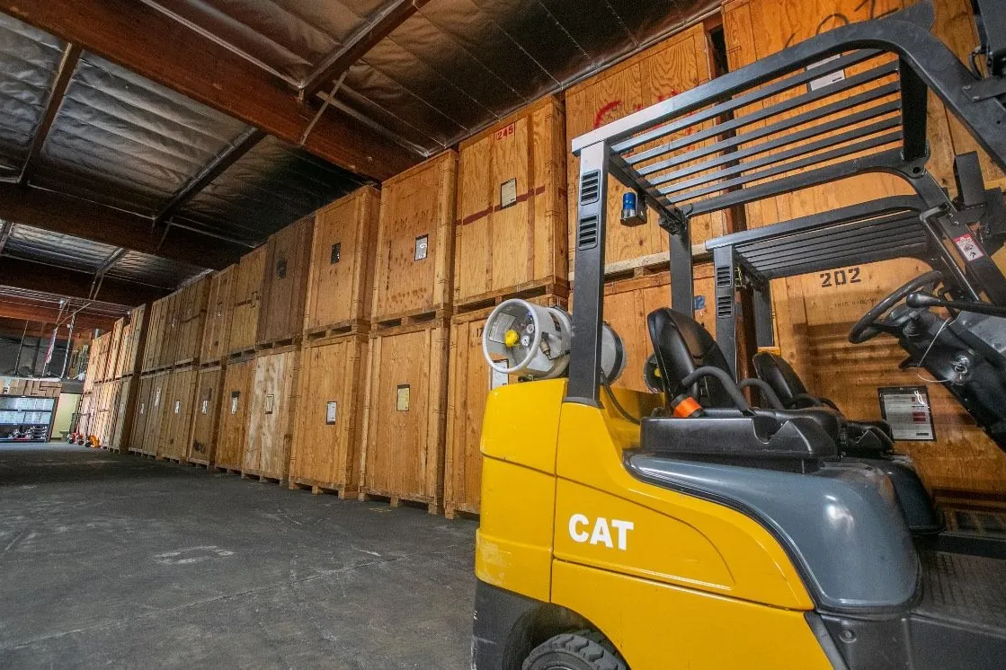 Storage vaults being moved in the warehouse